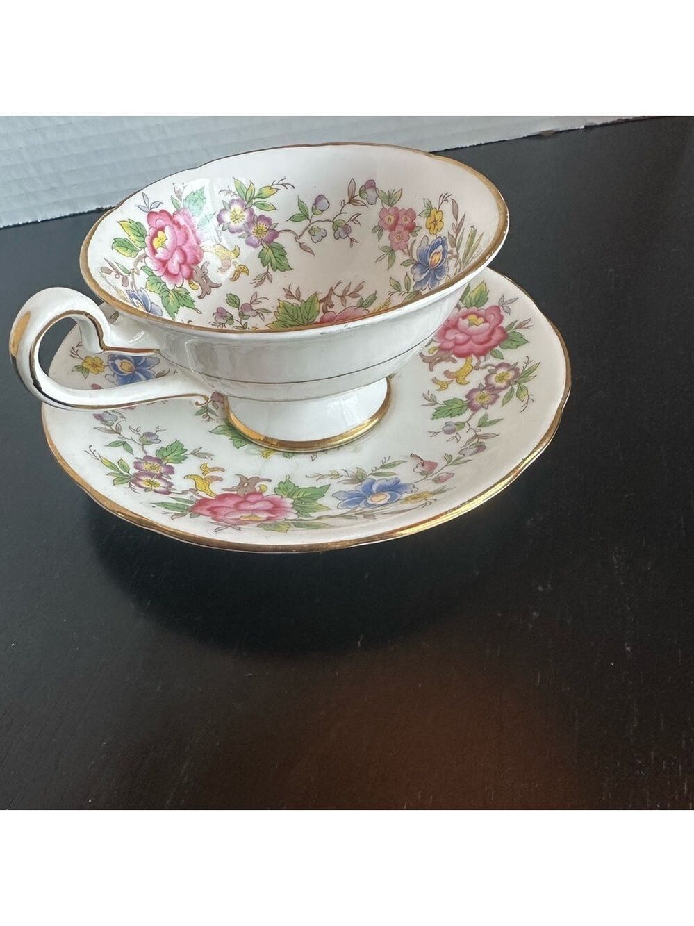 Royal Stafford bone china teacup and saucer set in the Rochester pattern.